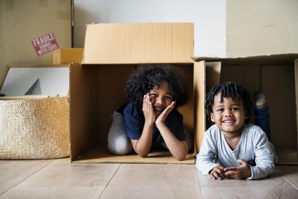 Cute kids in moving boxes