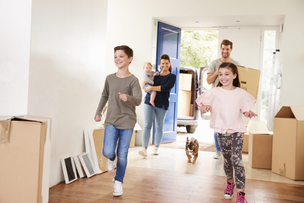 happy kids running into their new home