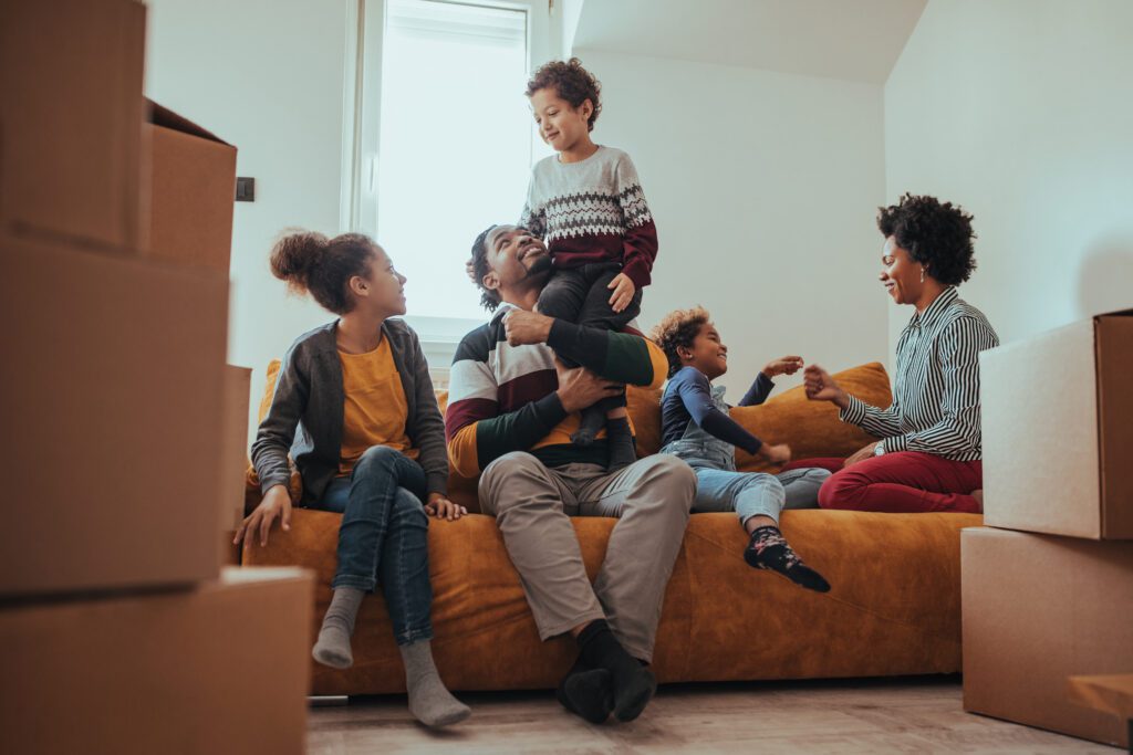 A family with young kids enjoying their new home