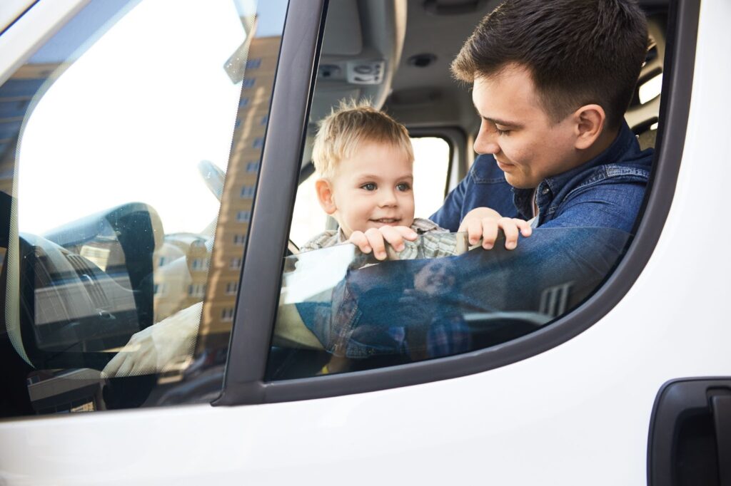 Father and son in a moving truck