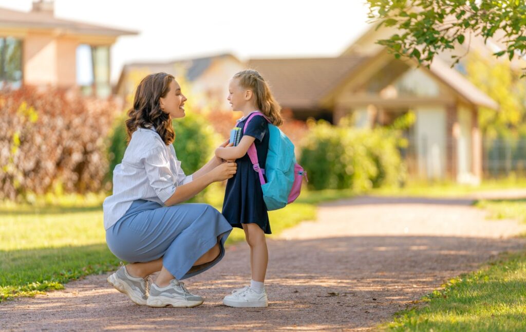 Mom dropping her daughter at school