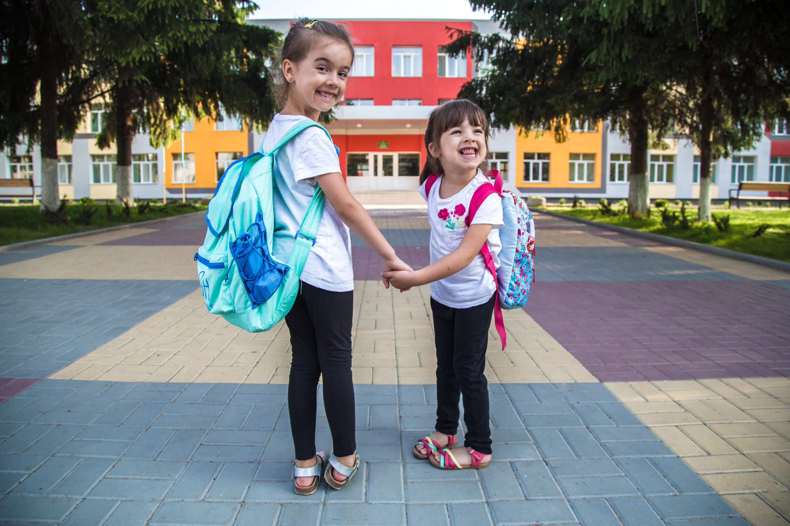 Two young girls' first day of school
