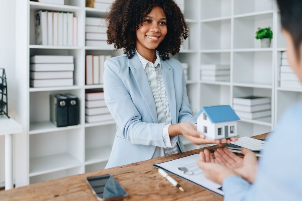 A realtor turning over a house to her client