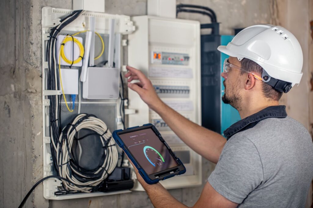 a home inspector testing the electrical panel of a house